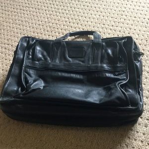 Tumi Black leather briefcase.